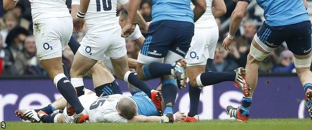 Mike Brown is knocked unconscious during England's game against Italy