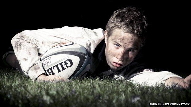 boy playing rugby