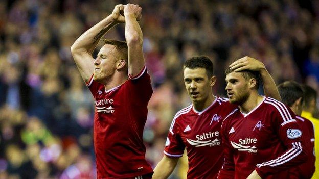 Aberdeen striker Adam Rooney (left)