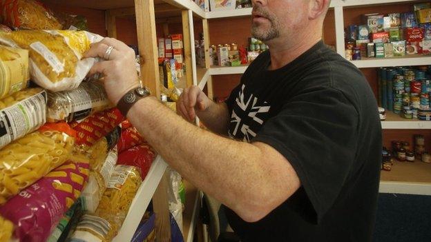 A volunteer at a food bank