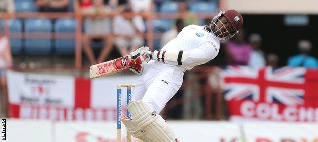 Marlon Samuels sways out of the way of an England bouncer