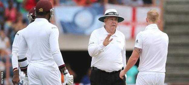 Umpire Steve Davis has a word with Stokes after the bowler takes his sledging a little too far