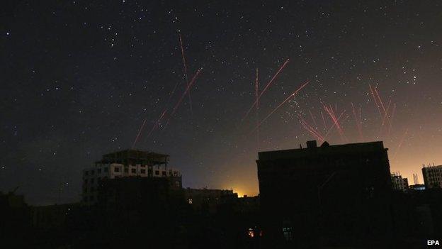 The sky over Sanaa is illuminated by anti-aircraft fire during Saudi-led coalition air strikes (21 April 2015)