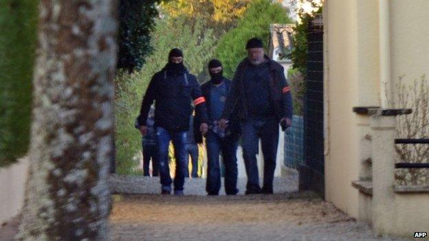 French policemen search the Vert-Bois neighbourhood in Saint-Dizier, on 22 April 2015,