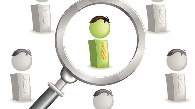 Magnifying glass and figures