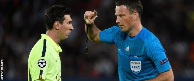 Lionel Messi and Mark Clattenburg