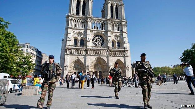 French police patrol outside Notre Dame Cathedral on 22 April 2015