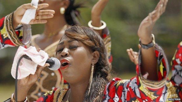 A Christian faithful from the World Victory Centre sings hymns during an Easter crusade service for the victims of the Garissa University attack in Kenya"s capital Nairobi 5 April 2015