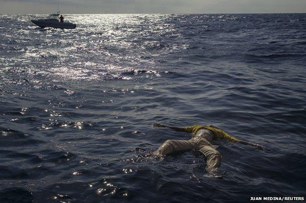 The body of a drowned migrant floats in the sea near the coast of Fuerteventura, one of Spain's Canary Islands January 18, 2004.