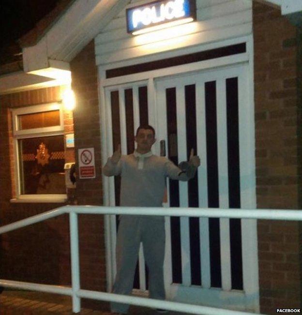 Aaron Bee outside a police station