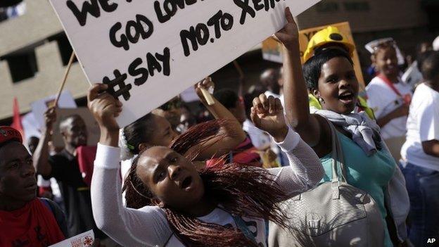 People attend a march against xenophobic attacks in downtown Johannesburg, South Africa, Thursday, 23 April 2015