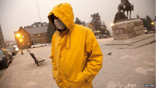 A resident walks by the Centro Civico (Civic Centre) covered with ash from the Calbuco volcano in the Patagonian Argentine city of San Carlos de Bariloche 23 April 2015