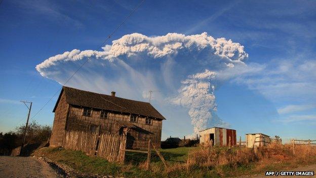 View from Puerto Montt, southern Chile, of a high column of ash and lava spewing from the Calbuco volcano, on 22 April 2015