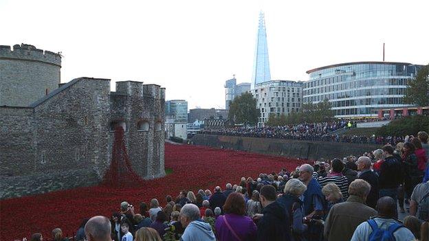 Visitors view the Blood Swept Lands and Seas of Red installation at Tower of London