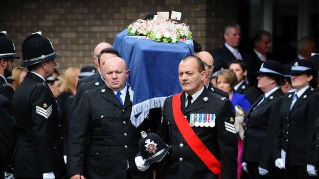 Sgt Louise Lucas's coffin is carried into the service