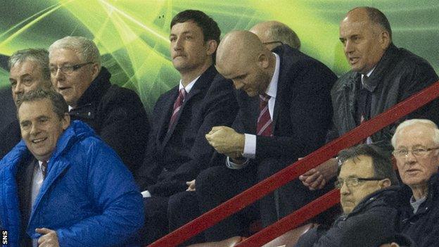 Martin Canning (centre) had to watch from the stand while serving a suspension