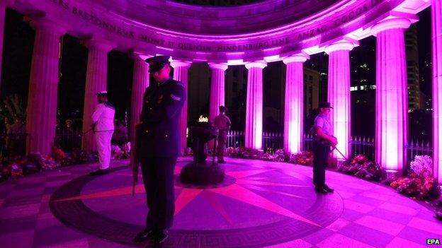 Defence Force personnel stand guard at the Eternal Flame during an Anzac Day Dawn Service in Brisbane, Australia (25 April 2015)