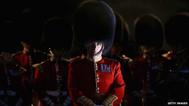 Members of the military attend the early morning Anzac Day Dawn Service at London's Wellington Arch