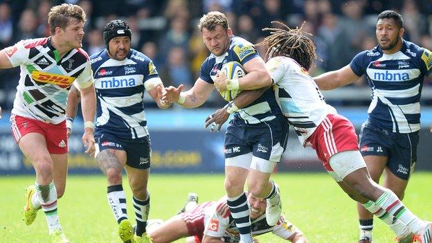 Sale's Mark Cueto is tacked by Harlequins winger Marland Yarde at the AJ Bell Stadium