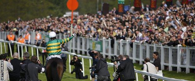 McCoy salutes the Sandown crowd after his final race