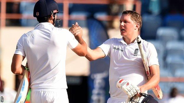 Alastair Cook celebrates with Gary Ballance