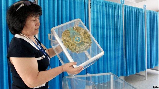 Official prepares a voting station in Astana