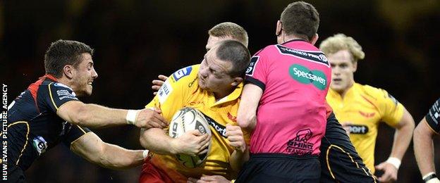 Ken Owens runs into George Clancy on the way to his try