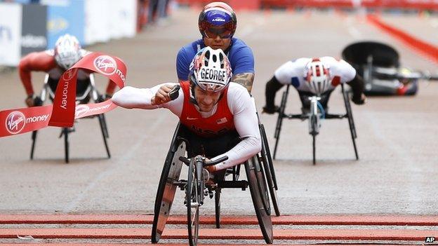 USA"s Joshua George wins the Men"s wheelchair race ahead of Great Britain"s David Weir