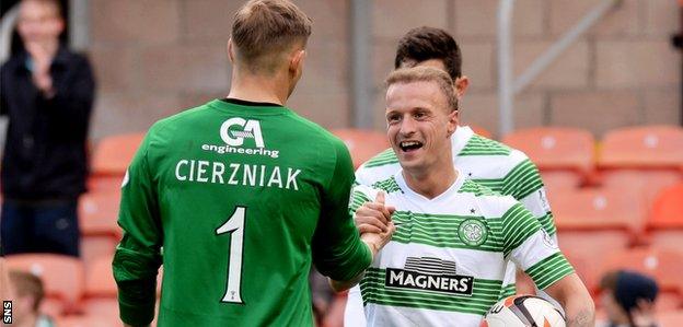 Celtic striker Leigh Griffiths shakes hands with Dundee Utd keeper Radoslaw Cierzniak after collecting the match ball at full-time