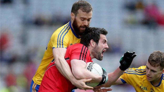 Roscommon's Senan Kilbride challenges Down's Kevin McKernan at Croke Park