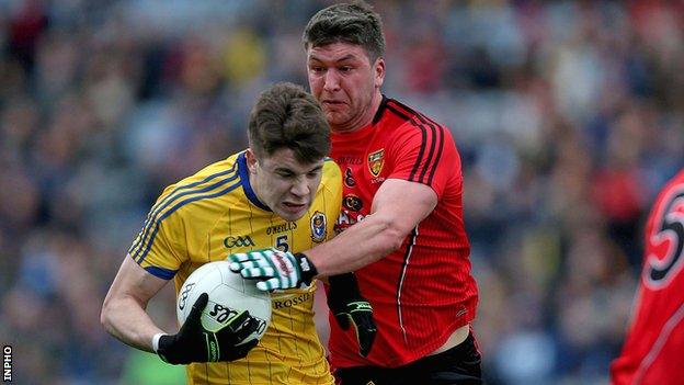 Roscommon's Conor Daly is challenged by Down's Paul Devlin in the Division 2 Football League final