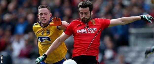 Down's Kevin McKernan tries to burst away from Roscommon's Kevin Higgins at Croke Park