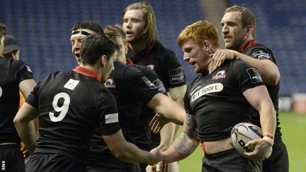 Edinburgh Rugby's Roddy Grant (centre) celebrates his try with team-mates Sam Hidalgo-Clyne (9) and Mike Coman (right)