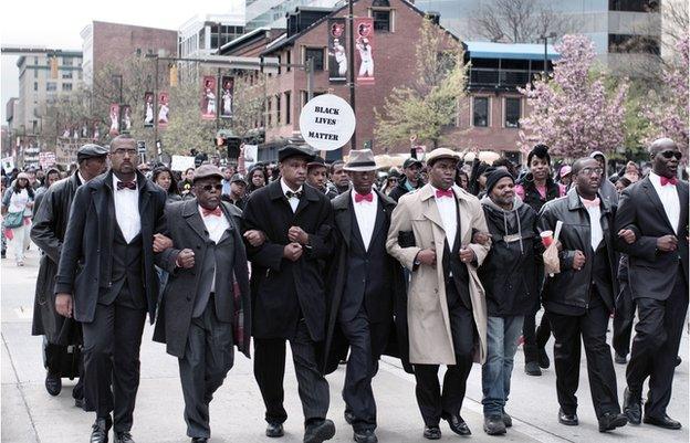 Marchers with linked arms