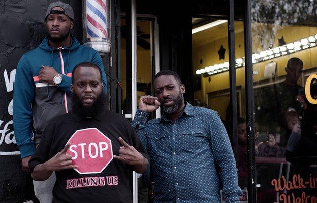 Men outside barbershop