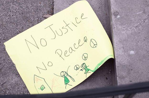 No justice no peace paper on the floor