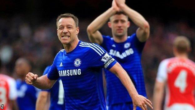 John Terry celebrates his team's point at Arsenal