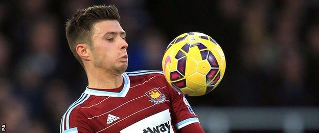 Aaron Cresswell controls the ball