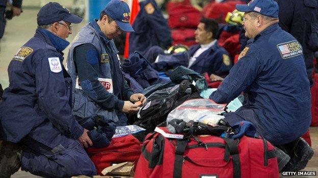 Rescue workers checking bags