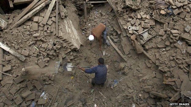 Rescuers using shovels