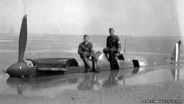 German soldiers on fuselage of Mark I Spitfire