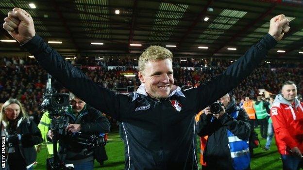 Eddie Howe celebrates on the pitch