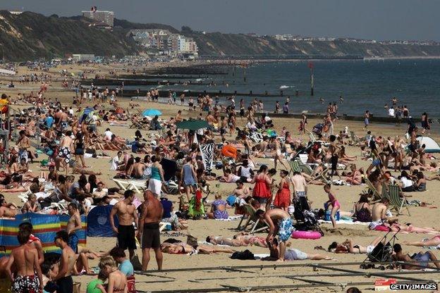 Sunbathers enjoy the sunshine on the beach on May 25, 2012 in Bournemouth