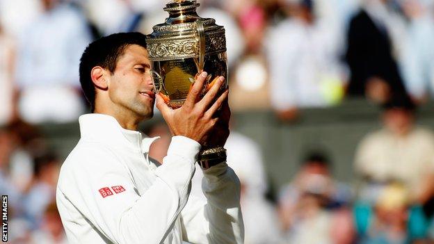 Novak Djokovic celebrates winning his 2014 Wimbledon title