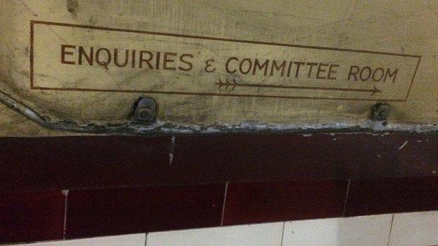 Enquiries and committee room sign