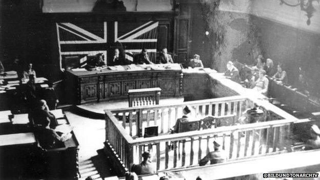 A British military court in Graz tries two people over the deaths at the Liebenau camp in Austria in 1947