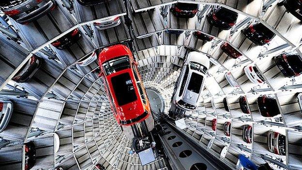 A new Volkswagen Passat and Golf 7 car are stored in a tower at the Volkswagen Autostadt complex near the Volkswagen factory on March 10, 2015 in Wolfsburg, Germany