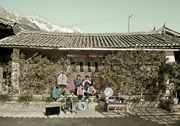 Lu Qunzhi with his family and possessions