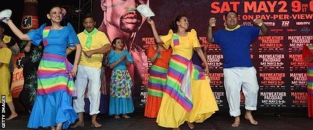 Filipino dancers at a Pacquiao fans rally