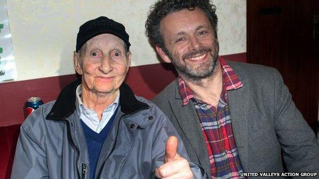 Michael Sheen and Dave Green together during shooting of a documentary